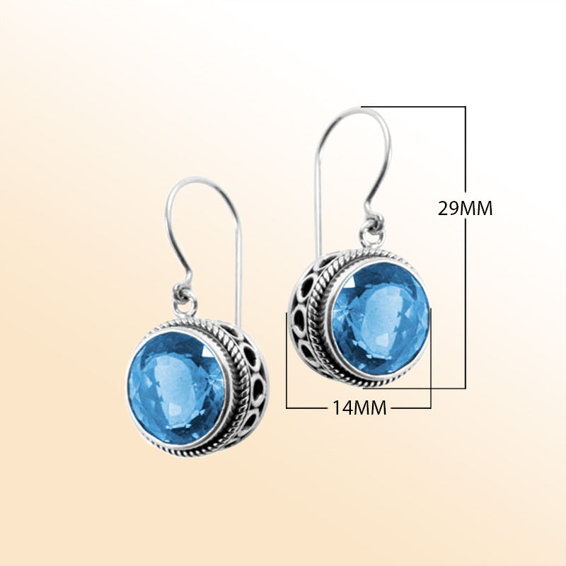 Sterling silver artisan earrings featuring Blue Quartz in an ornate halo with earwire lock.