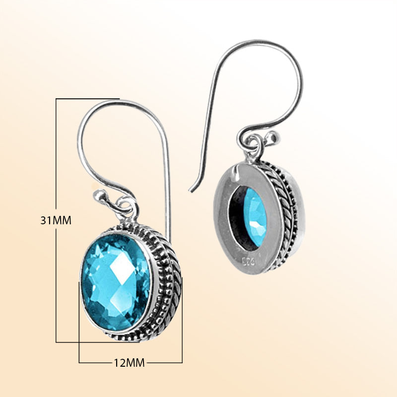 Sterling silver artisan earrings featuring Blue Topaz Quartz with detailed frame and earwire lock.