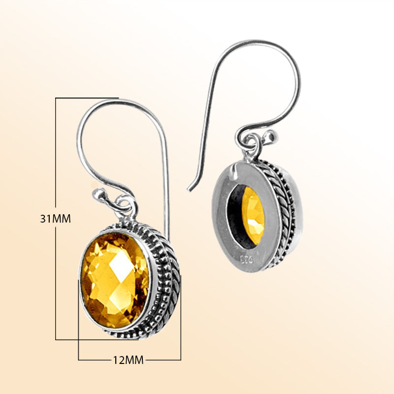 Sterling silver artisan drop earrings featuring Citrine Quartz in an ornate frame with earwire lock.