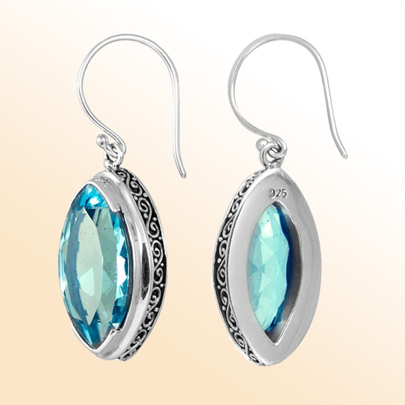 Sterling silver artisan marquise drop earrings featuring Blue Topaz Quartz with intricate detailing and earwire lock.