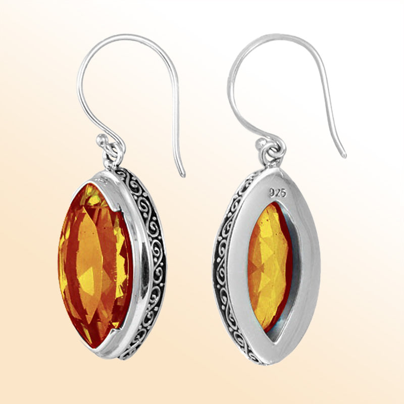 Sterling silver artisan marquise drop earrings featuring Citrine Quartz with ornate detailing and earwire lock.
