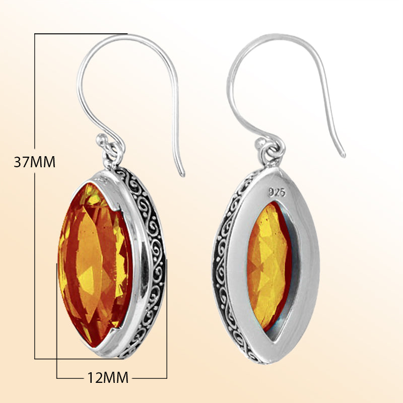 Sterling silver artisan marquise drop earrings featuring Citrine Quartz with ornate detailing and earwire lock.