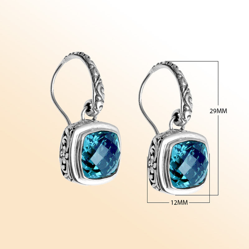 Sterling silver artisan Blue Topaz Quartz cushion drop earrings with ornate detailing and earwire lock.