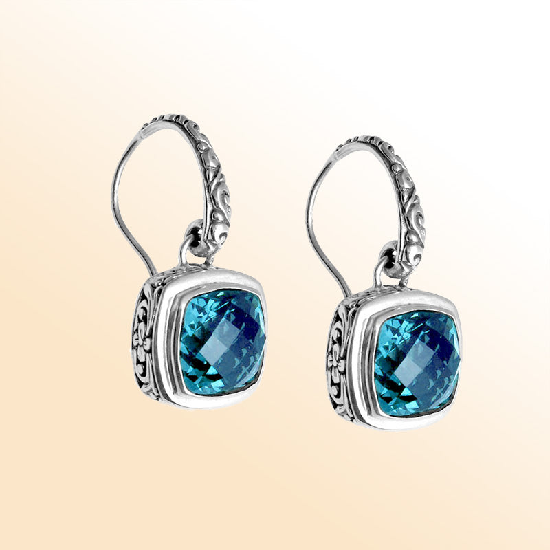 Sterling silver artisan Blue Topaz Quartz cushion drop earrings with ornate detailing and earwire lock.