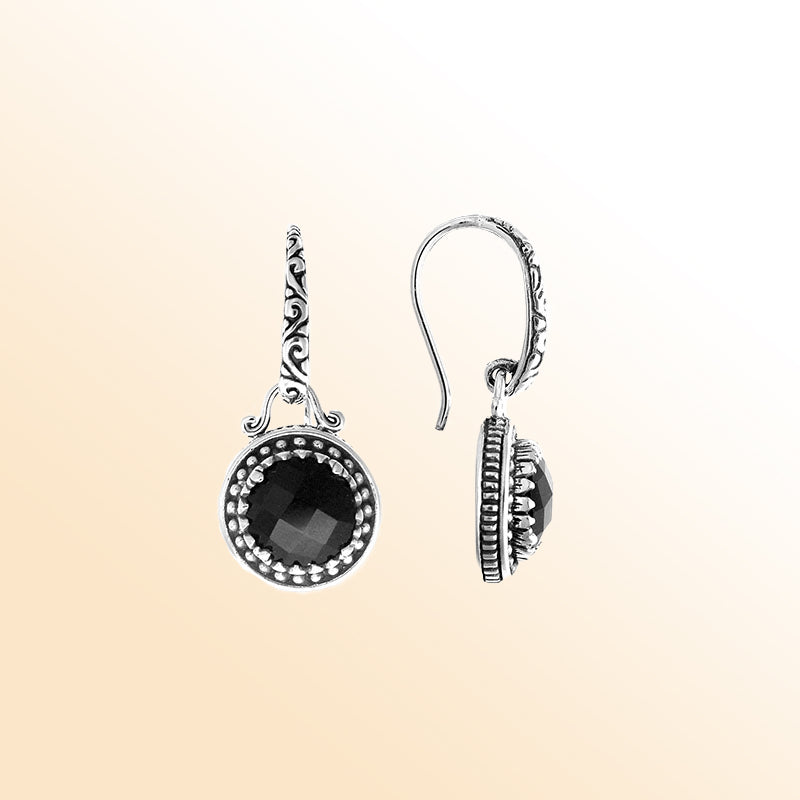 Sterling silver artisan earrings with round Black Onyx and handcrafted metal detailing.