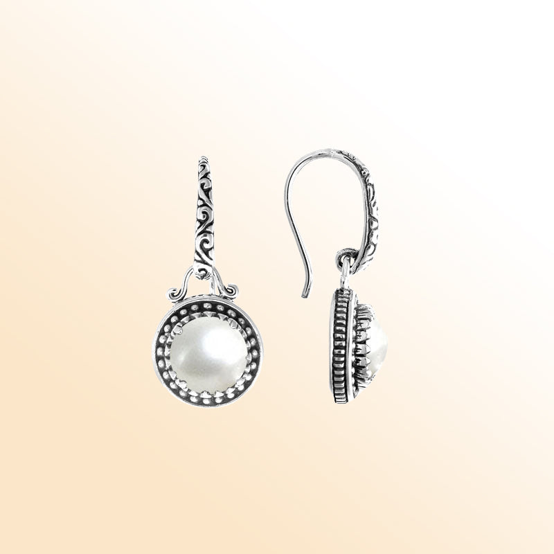 Sterling silver artisan earrings with round Mabe Pearl and handcrafted detailing.