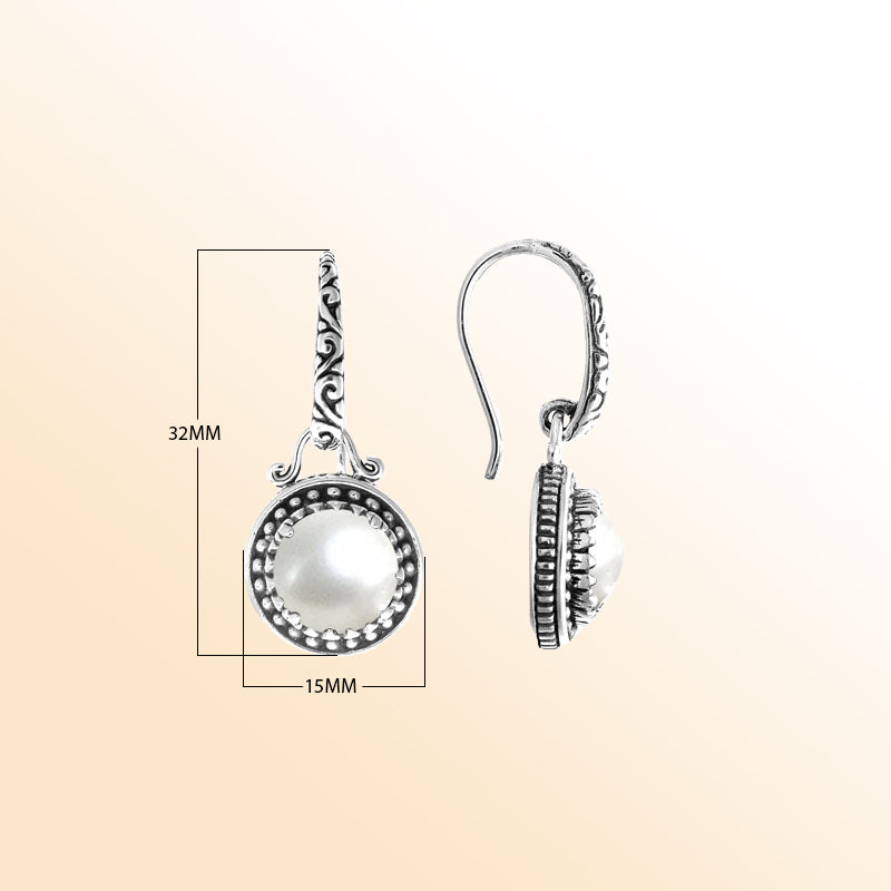 Sterling silver artisan earrings with round Mabe Pearl and handcrafted detailing.