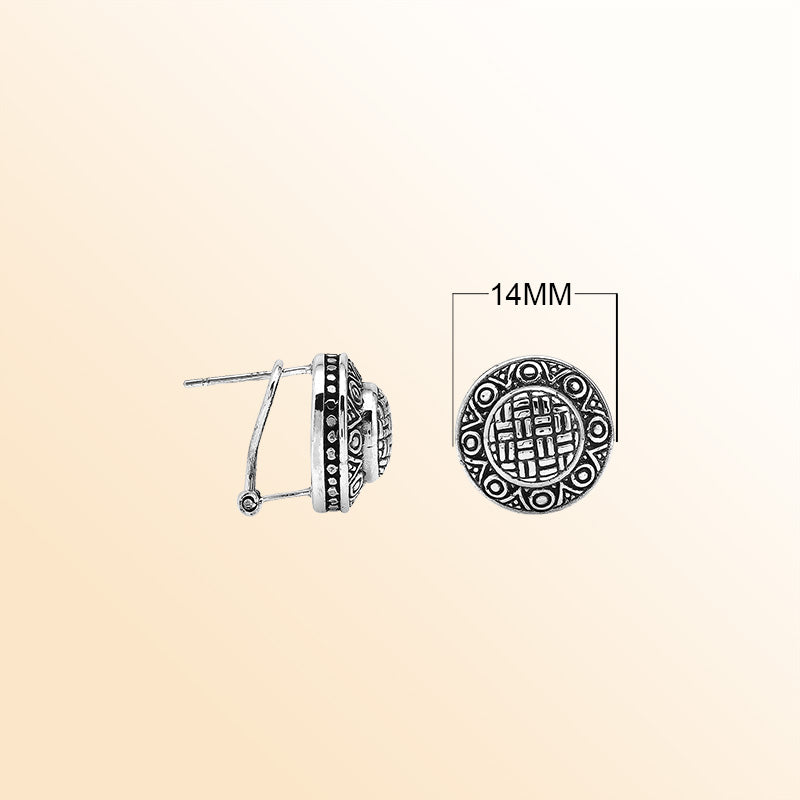 Sterling silver artisan round earrings with carved geometric pattern and omega clip closure.