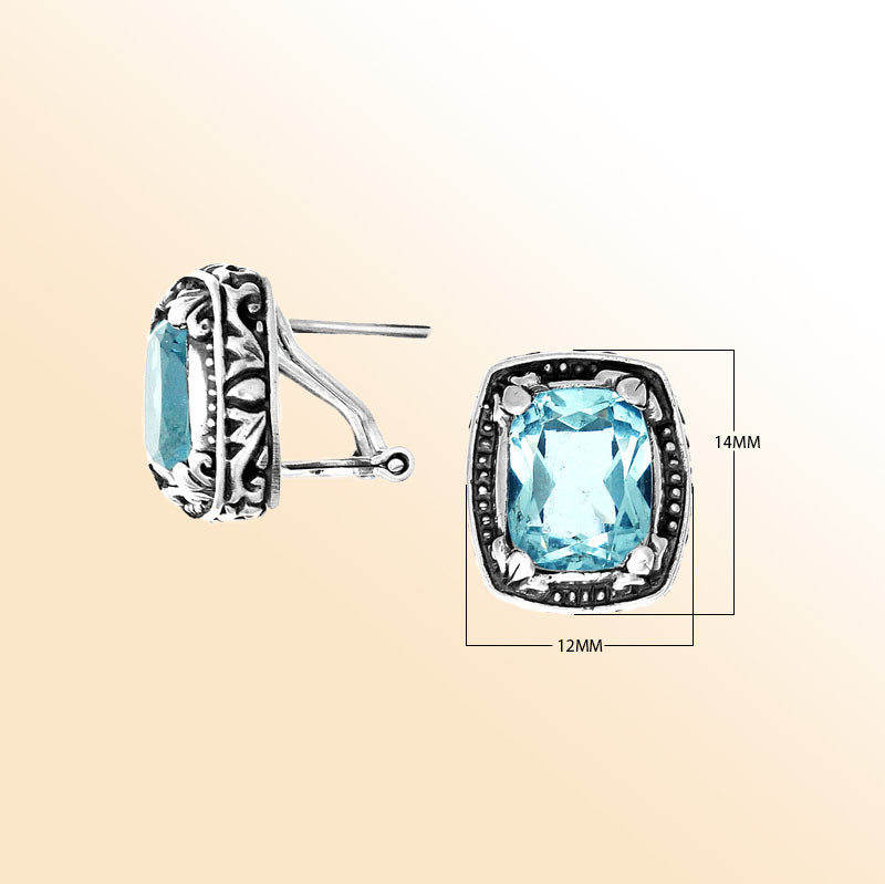Sterling silver artisan earrings with Blue Topaz Quartz in a cushion frame and omega clip closure.