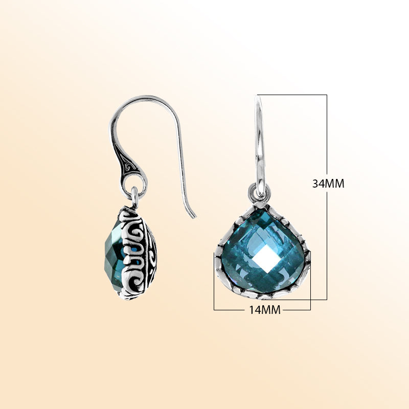 Sterling silver artisan teardrop earrings with Blue Topaz Quartz and carved detailing.