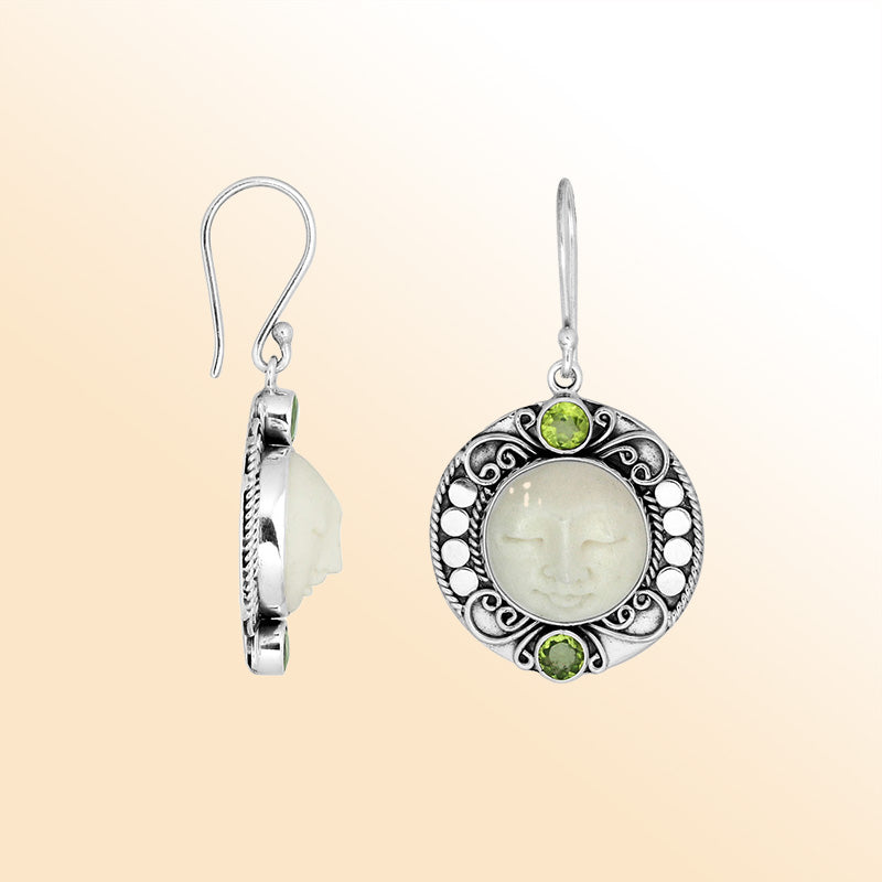 Sterling silver earrings with serene bone face carving and Peridot Quartz accents.