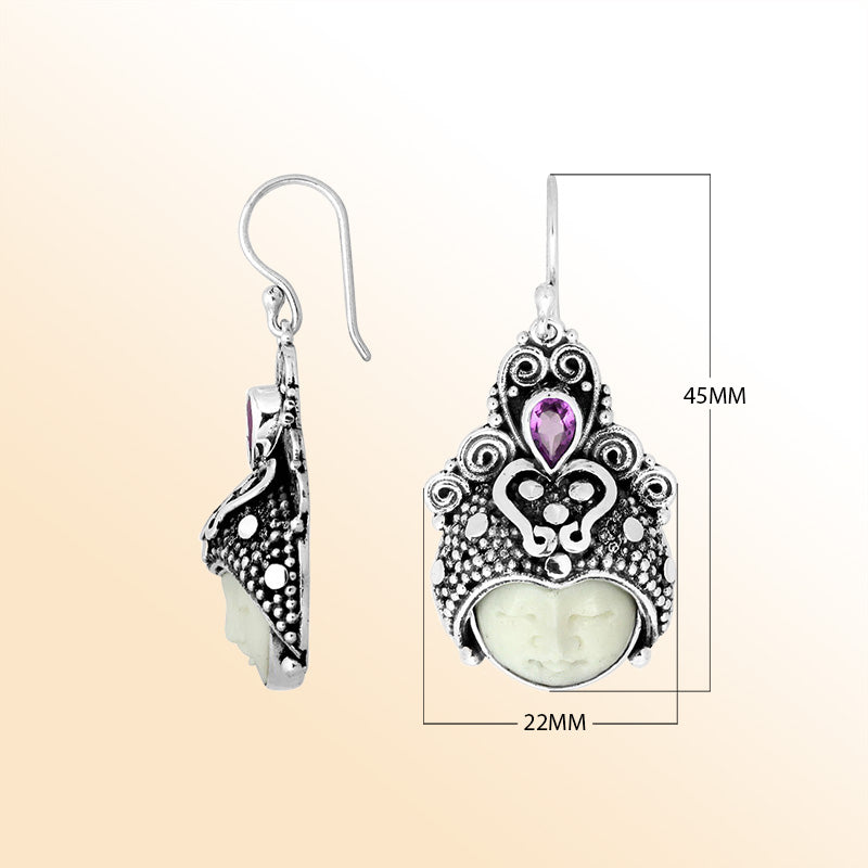 Sterling silver moon-headdress earrings featuring carved bone face and Amethyst Quartz accent.