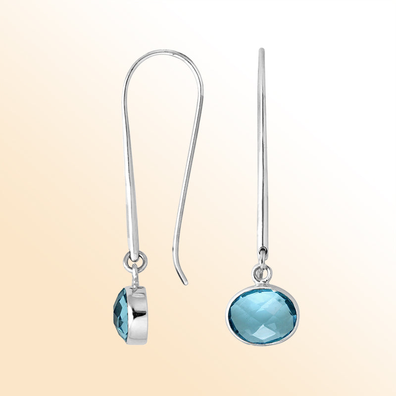 Handcrafted sterling silver drop earrings featuring oval-cut Blue Topaz Quartz stone