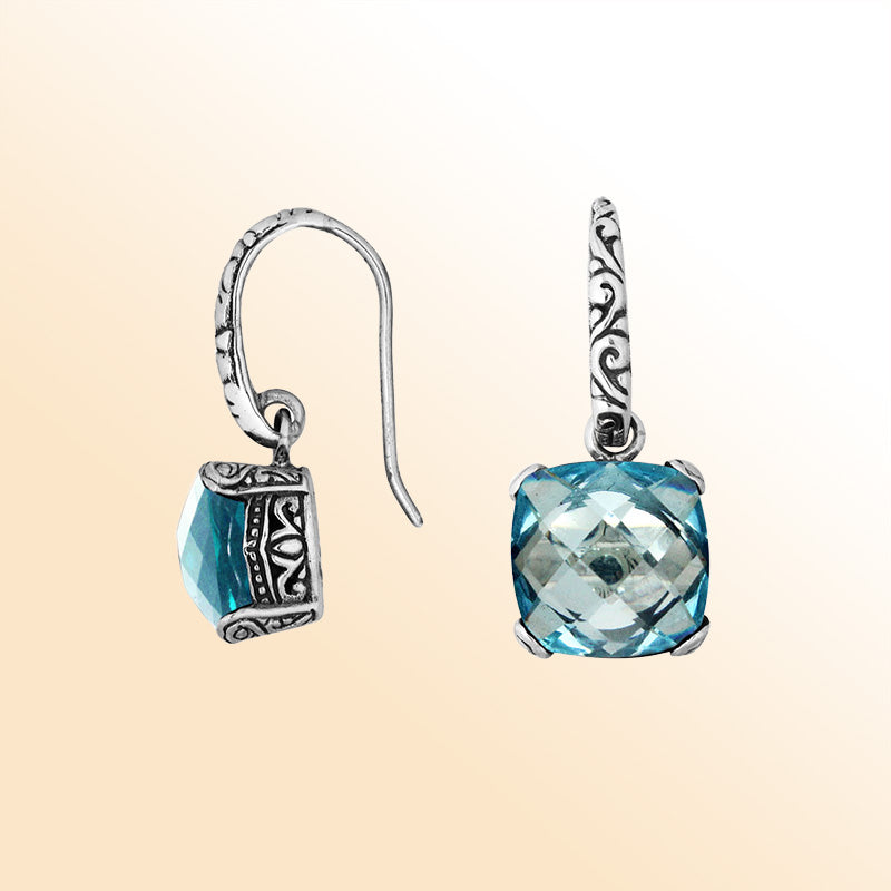Handcrafted sterling silver drop earrings featuring cushion-cut Blue Topaz Quartz