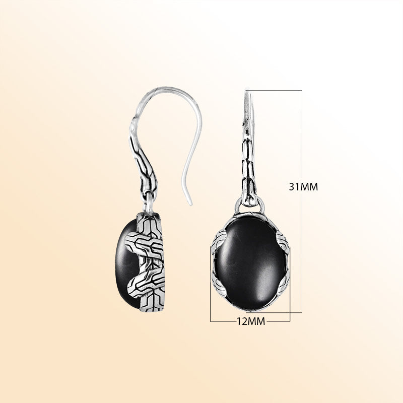 Handcrafted sterling silver Black Onyx oval drop earrings with antique oxidized texture and earwire lock for elegant wear.