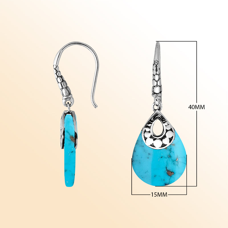 Artisan sterling silver earrings featuring flowing Turquoise Shell drops in an expressive teardrop frame.