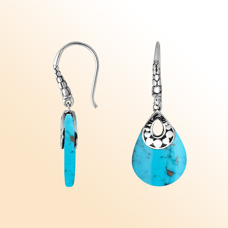 Artisan sterling silver earrings featuring flowing Turquoise Shell drops in an expressive teardrop frame.