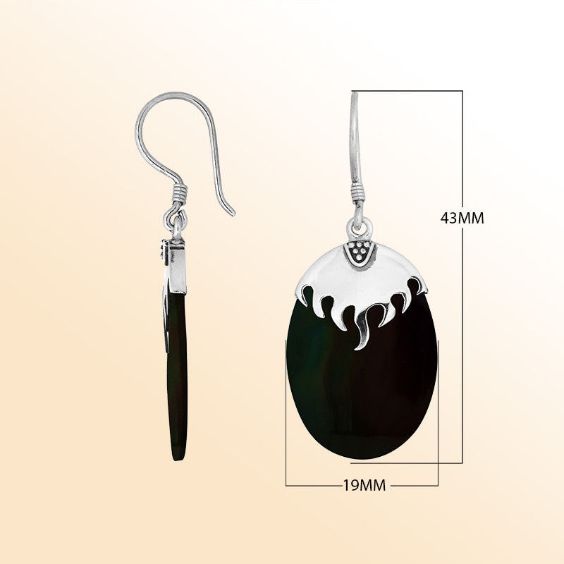 Artisan sterling silver earrings with deep Black Shell ovals beneath a flame-inspired sculpted silver cap.