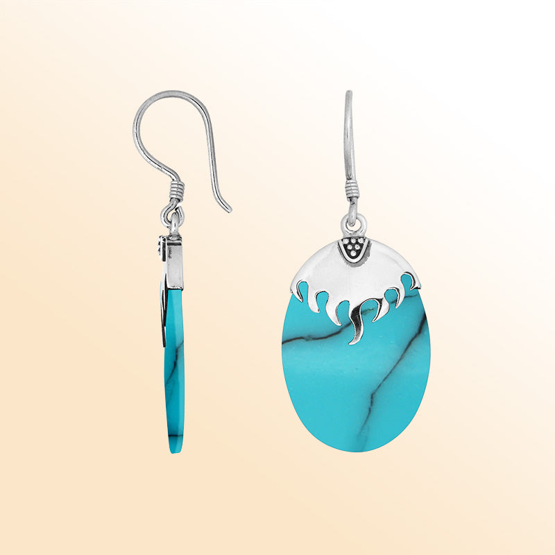 Wholesale sterling silver earrings with Turquoise Shell ovals and a smooth structured silver cap.