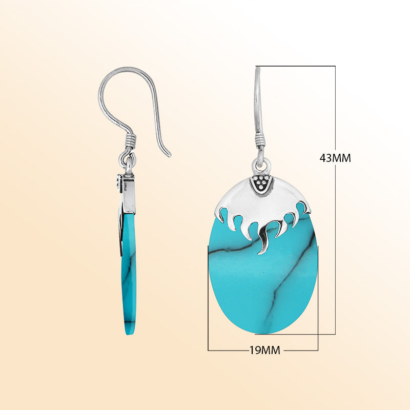 Wholesale sterling silver earrings with Turquoise Shell ovals and a smooth structured silver cap.