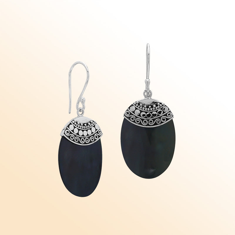 Artisan sterling silver earrings with Black Shell ovals and a decorative ornate patterned silver cap.