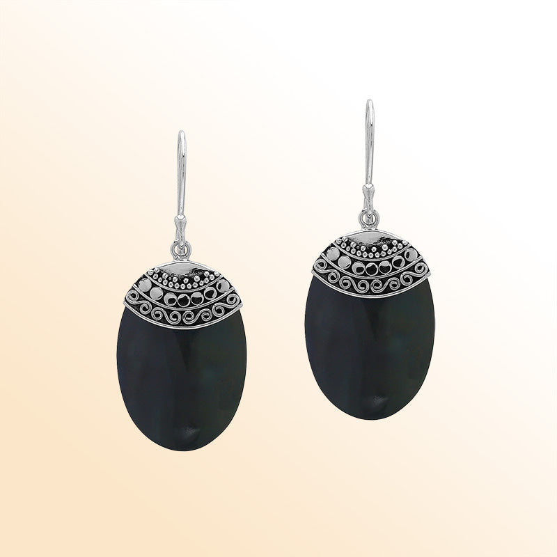 Artisan sterling silver earrings with Black Shell ovals and a decorative ornate patterned silver cap.