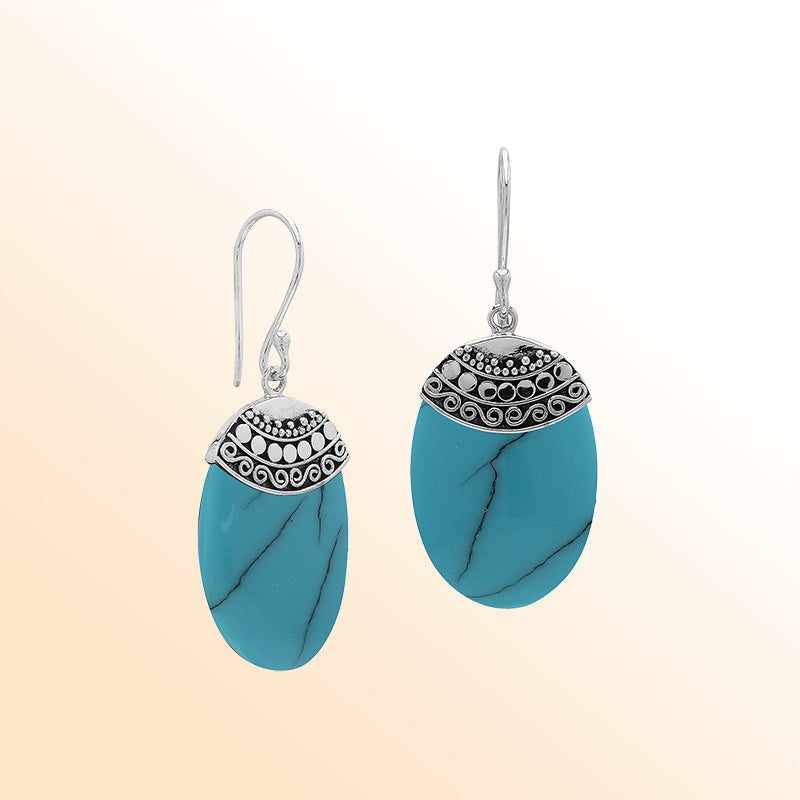 Artisan sterling silver earrings with Turquoise Shell ovals and a decorative ornate patterned silver cap.