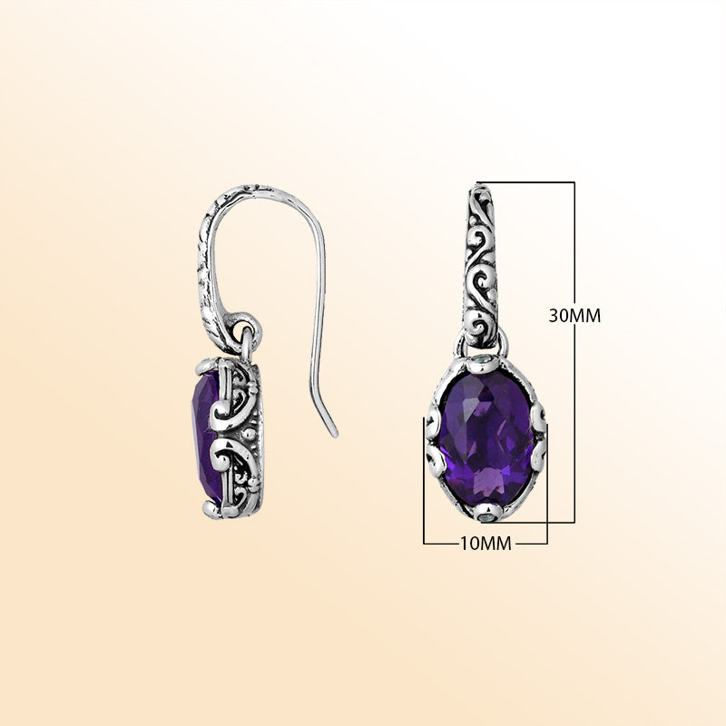 Artisan sterling silver earrings with oval Amethyst Quartz framed in ornate scroll-accented settings.