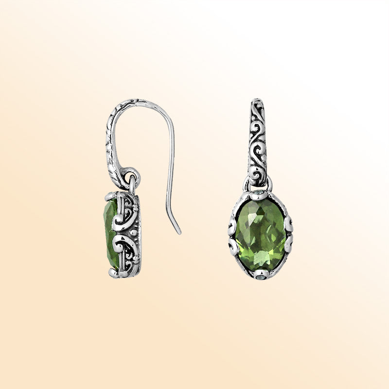 Artisan sterling silver earrings featuring luminous Green Amethyst Quartz in ornate scroll-accented oval frames.