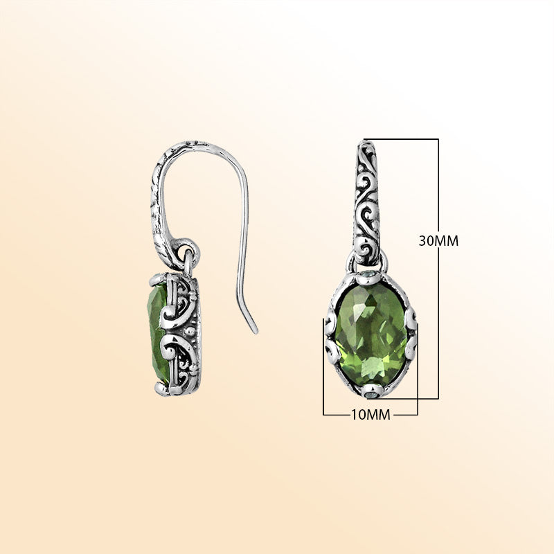 Artisan sterling silver earrings featuring luminous Green Amethyst Quartz in ornate scroll-accented oval frames.
