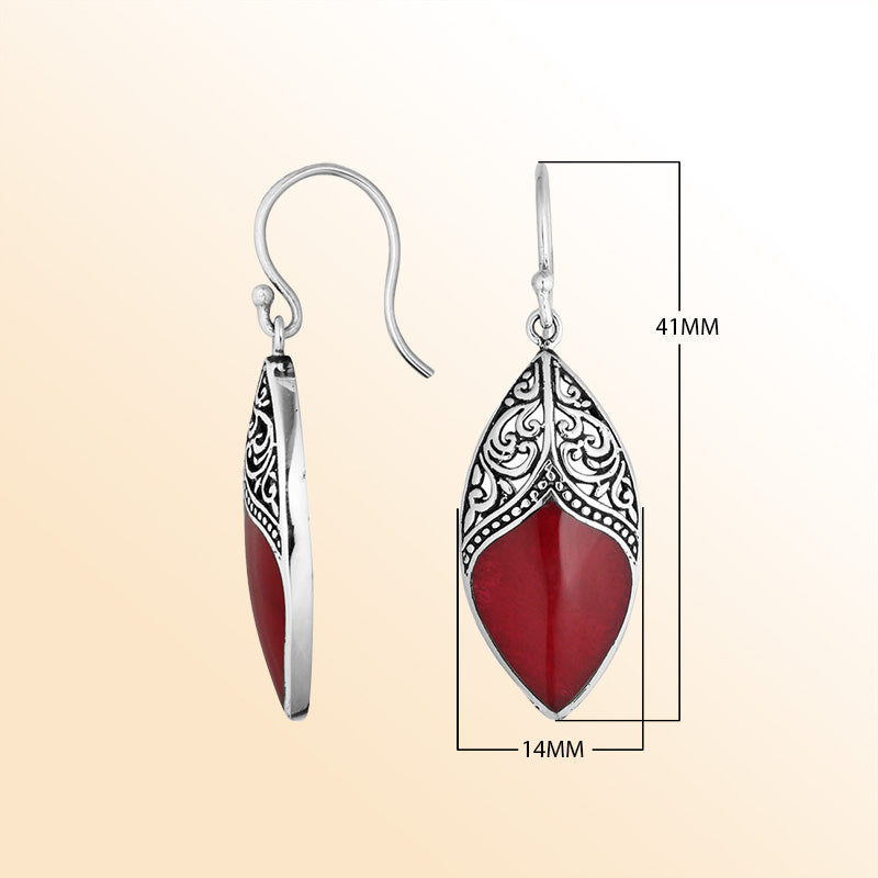 Artisan sterling silver earrings with vibrant Red Coral marquise drops framed by ornate detailing.