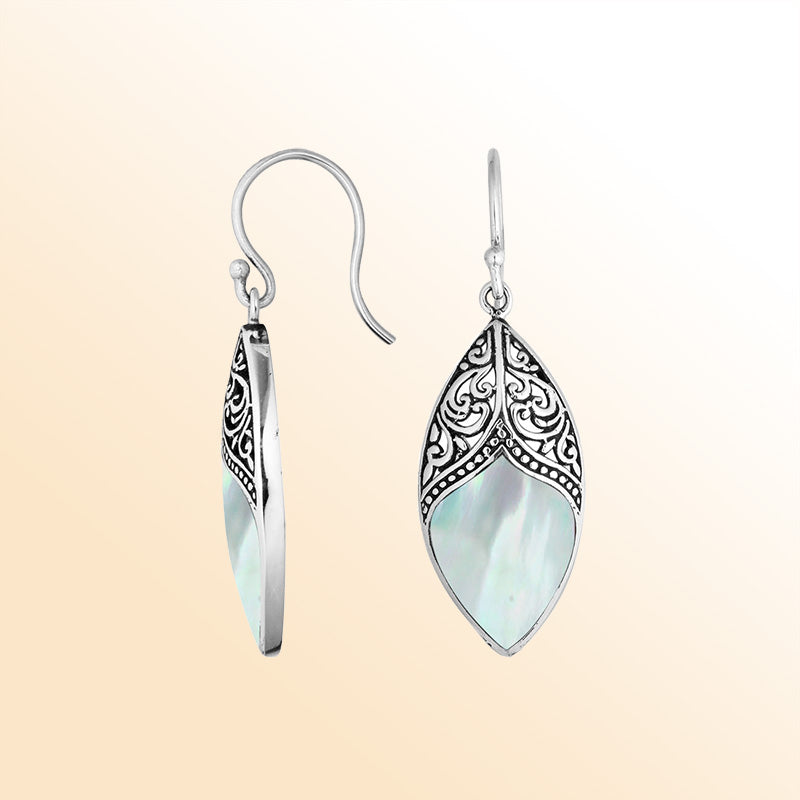 Artisan sterling silver marquise earrings with luminous Mother Of Pearl framed by ornate detailing.