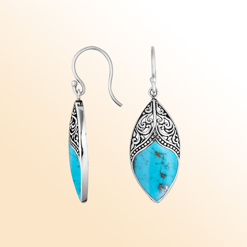 Artisan sterling silver marquise earrings featuring bright Turquoise Shell with ornate decorative framing.