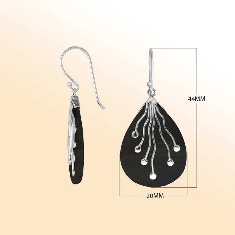 Artistic sterling silver earrings with dancing tendrils flowing over glossy Black Shell teardrops.