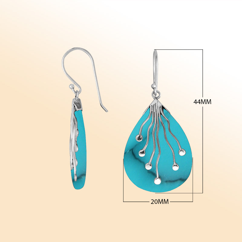Sterling silver teardrop Turquoise Shell earrings with artistic silver detailing handcrafted by artisans