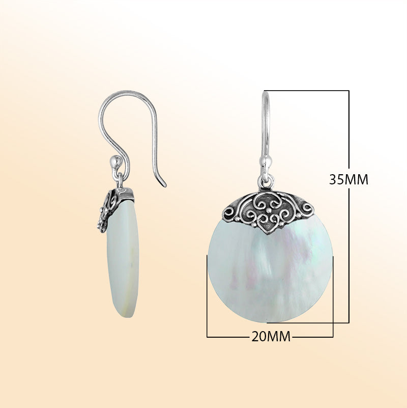 Artisan sterling silver round earrings showcasing glowing Mother Of Pearl with polished handcrafted silver detailing.