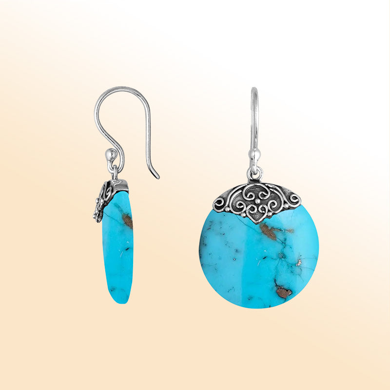 Artisan sterling silver round earrings featuring vivid Turquoise Shell with polished handcrafted detailing.