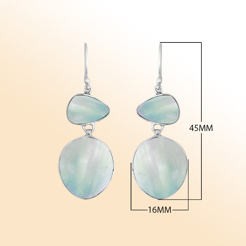 Artisan sterling silver double-drop earrings featuring soft iridescent Mother Of Pearl with polished handcrafted detailing.