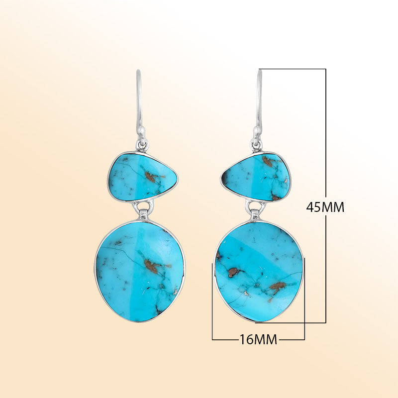 Artisan sterling silver double-drop earrings featuring vibrant Turquoise Shell with polished handcrafted detailing.