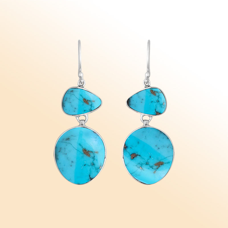 Artisan sterling silver double-drop earrings featuring vibrant Turquoise Shell with polished handcrafted detailing.