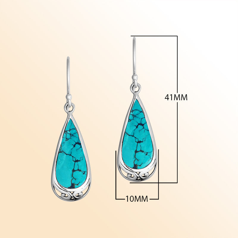 Artisan-style silver teardrop earrings showcasing vibrant Turquoise Shell with softly polished handcrafted accents.
