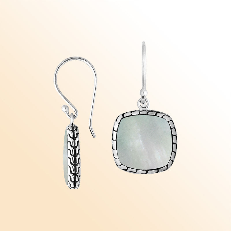 Artistic cushion earrings with Mother Of Pearl and silver textured edging
