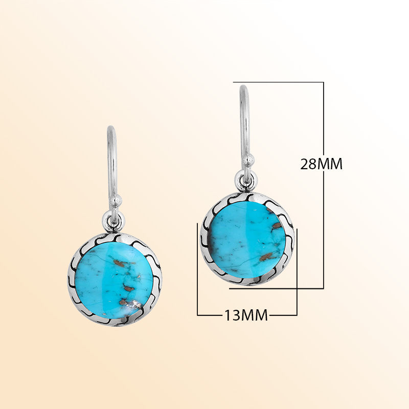 Sterling silver earrings with round Turquoise Shell inlay and polished detailing.