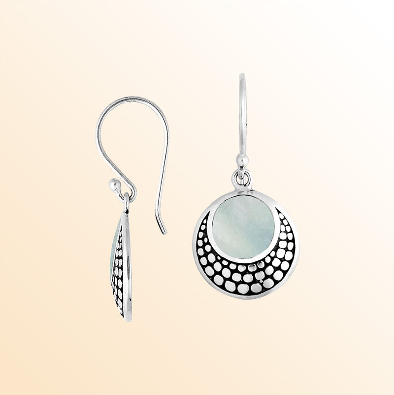 Sterling silver earrings with round Mother Of Pearl inlay and dotted silver pattern.