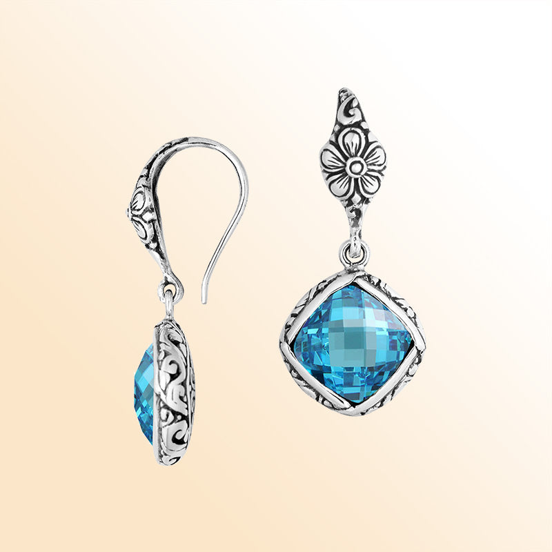 Sterling silver earrings with Blue Topaz Quartz cushion-cut stone and floral detailing.