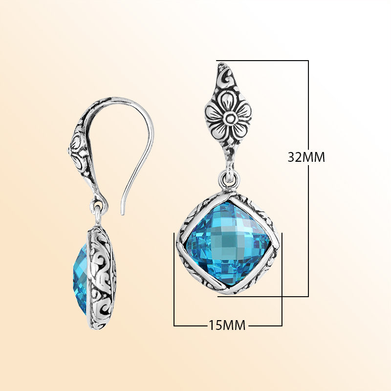 Sterling silver earrings with Blue Topaz Quartz cushion-cut stone and floral detailing.