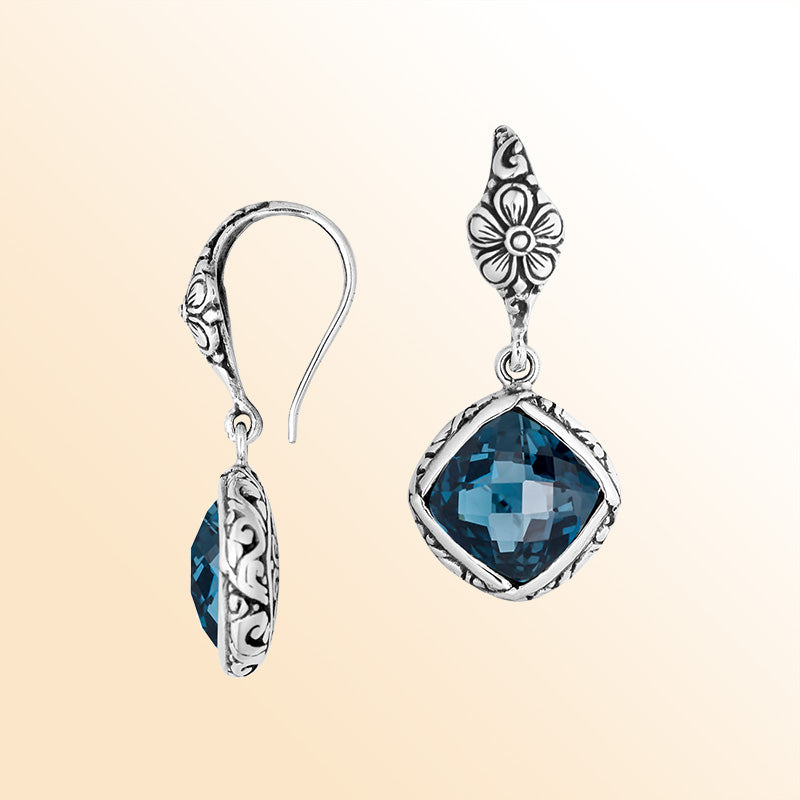 Sterling silver earrings with London Blue Topaz Quartz cushion-cut stone and floral design.