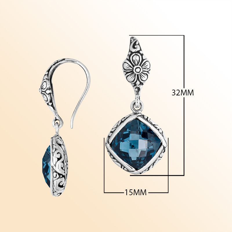Sterling silver earrings with London Blue Topaz Quartz cushion-cut stone and floral design.