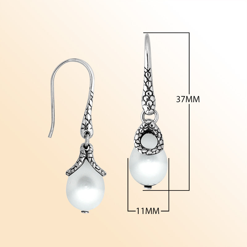 Sterling silver earrings with White Pearl teardrop design and polished silver detailing.