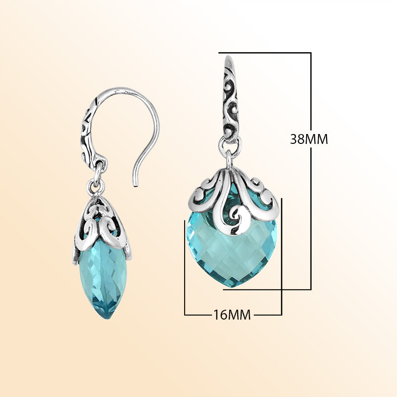 Sterling silver earrings with Blue Topaz Quartz faceted teardrop design and ornate silver detailing.